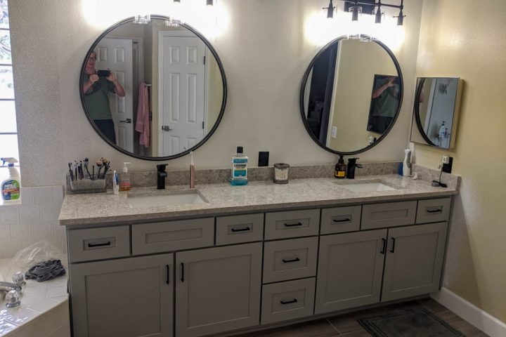 double vanity of a master bathroom, granite countertop with townsquare grey cabinet doors
